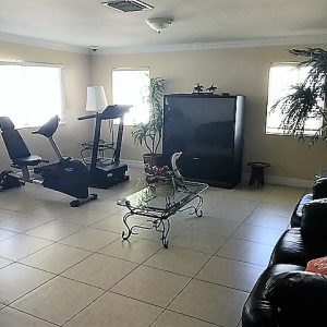 Golden Breeze Manor 3 - exercise and tv room 2.JPG