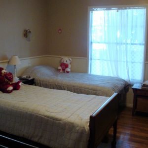 JC Cottages - Hollydale shared room.JPG